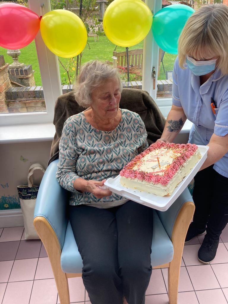 Care worker celebrating a resident's birthday